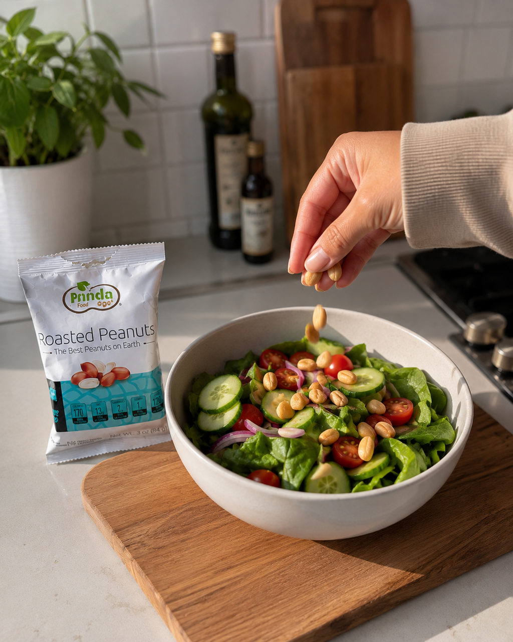 Pinda Lightly Salted Roasted Peanuts being sprinkled on a fresh salad