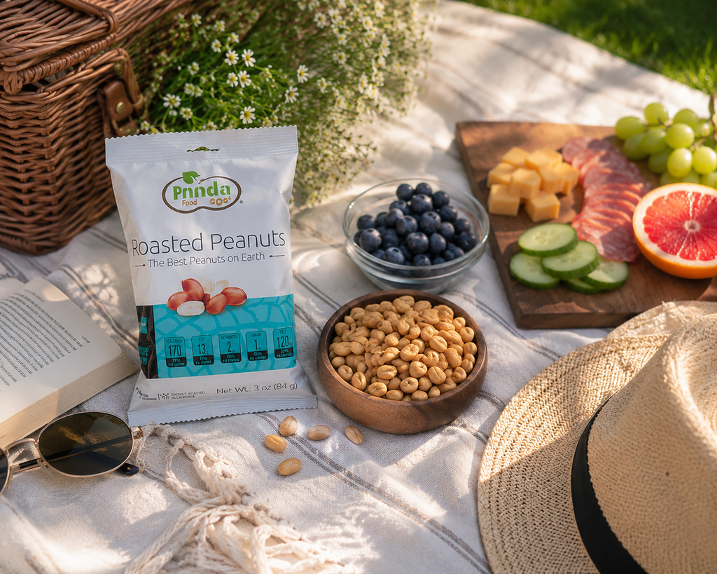Pinda Lightly Salted Roasted Peanuts at a picnic with fresh fruit and blueberries